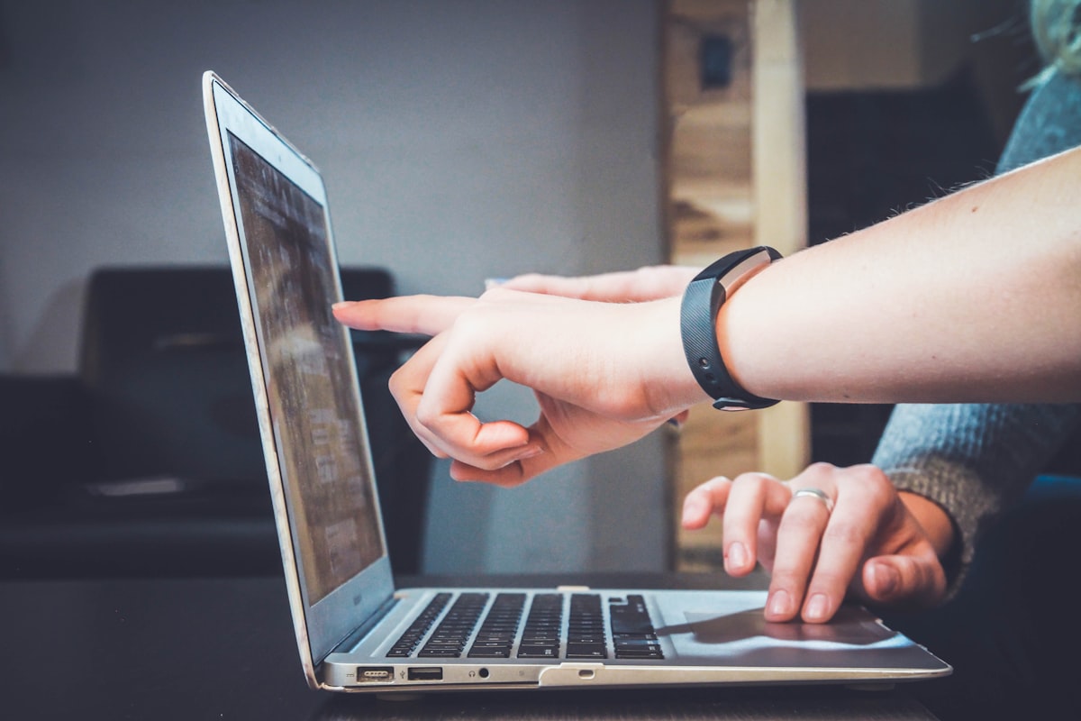 Business owner managing online presence on a laptop